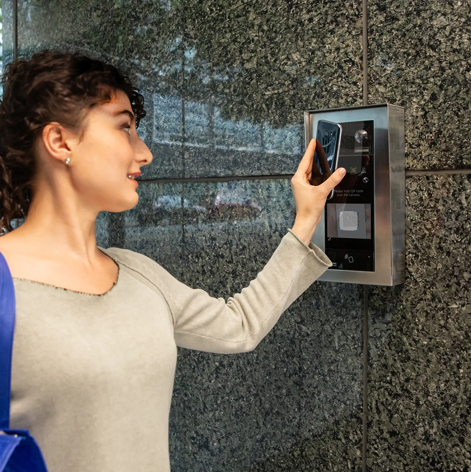 A woman is holding her hand up to the wall