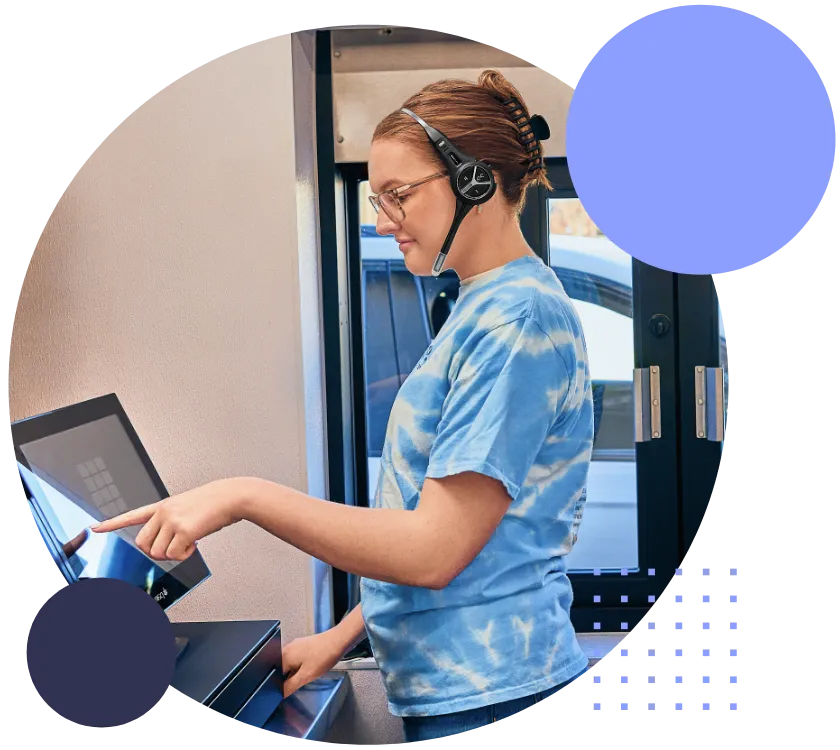 par-clear-headset-difference-img A woman wearing headphones and using a laptop.