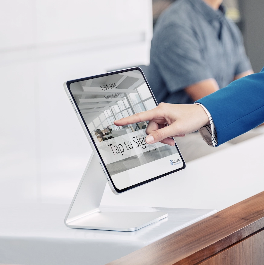 A person is touching an ipad on the counter.