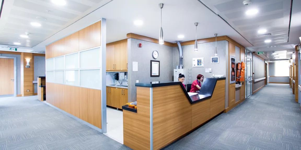FL-WB-medical-featured-2880x1440 A person sitting at the front desk of an office.