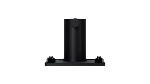 A black object is shown on top of a table.